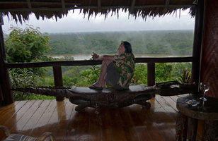 Patrick Blanc waiting in his room verandah during a rainy day, Karawari, Sepik, Papua New Guinea, March 2016