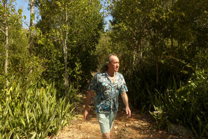 Patrick Blanc walking in coastal karst dry forest among the invasive Sansevieria, Guardalavaca, Cuba, Feb. 2017