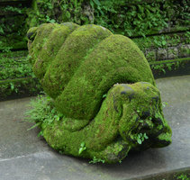 Stone snail covered in algae and mosses, Ubud, Bali