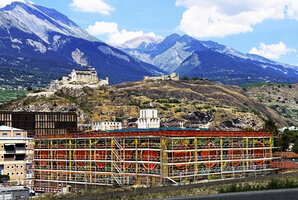 The Vertical Garden wrapping the new Oiken electric substation seen from the highway, still with the scaffolding at the end of the plant installation, Sion, Switzerland, June 2026